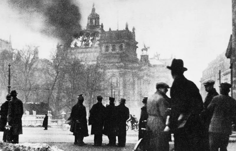 Germans look on as the Reichstag building burns